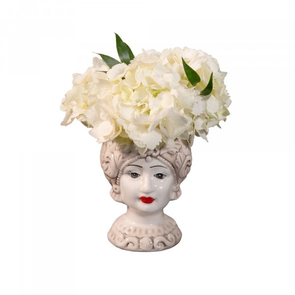 εκρού βάζο σε σχήμα κεφαλιού γυναίκας με λουλούδια